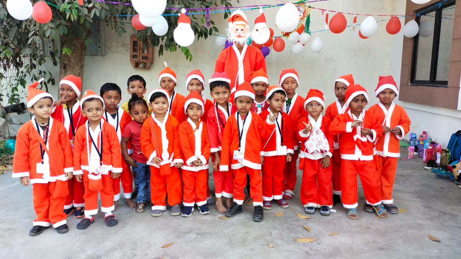 Christmas celebration with children in festive costumes